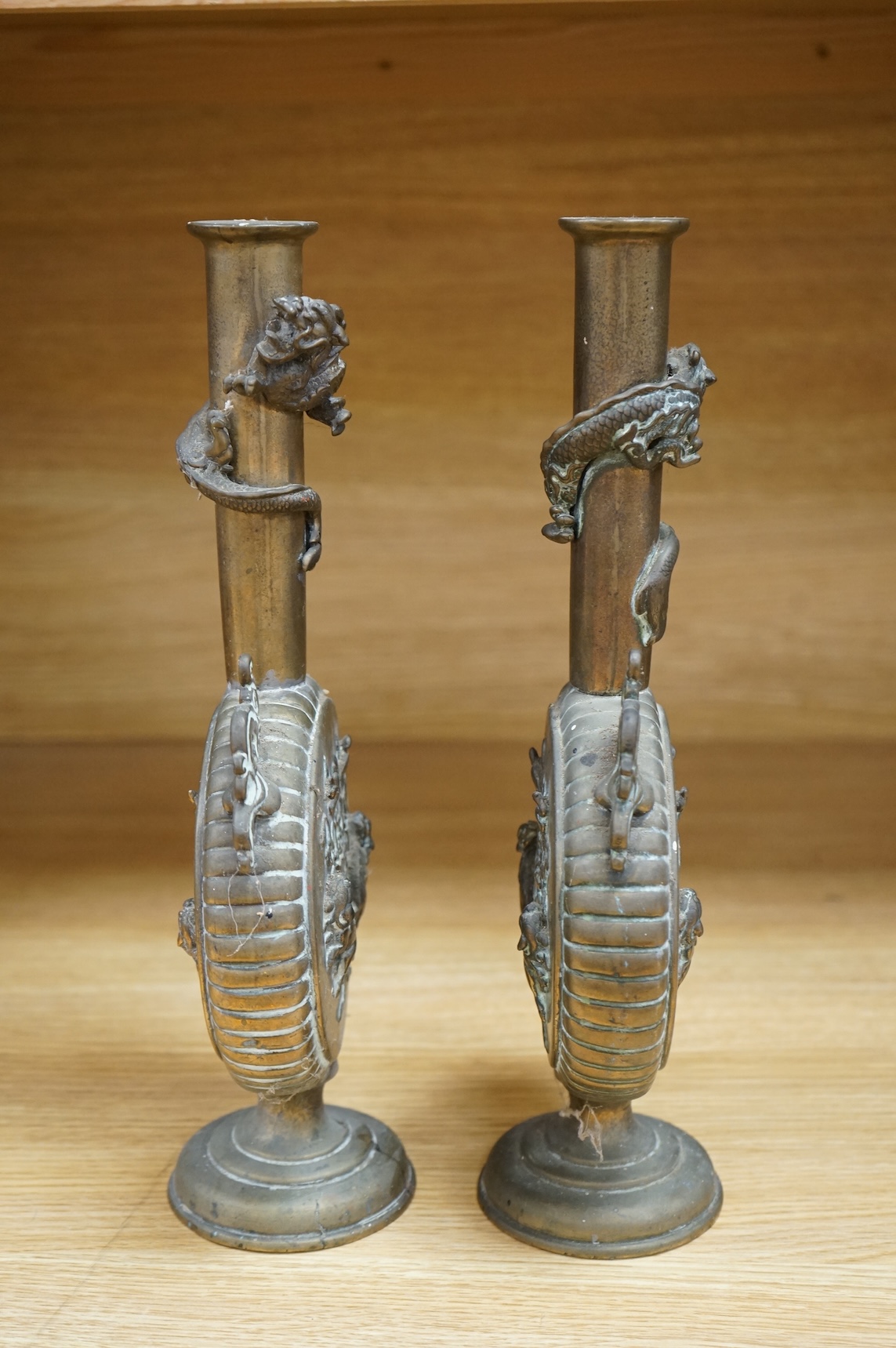 A pair of 19th century Japanese bronze moonflasks, with dragon motifs, 35cm high
